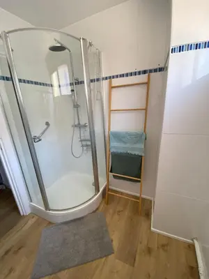 a shower with a glass door in a bathroom at Ajaccio centre bord de mer T3 in Ajaccio