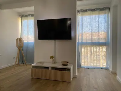 a living room with a flat screen tv on the wall at Ajaccio centre bord de mer T3 in Ajaccio