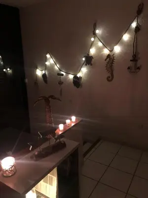 a room with lights and candles on the wall at 2026 - grand studio avec piscine et plage à 50 m in San-Nicolao