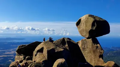 two people sitting on top of a rock formation at Villa calme avec piscine chauffée - 6 personnes - Figari proche Porto-Vecchio et Bonifacio in Figari