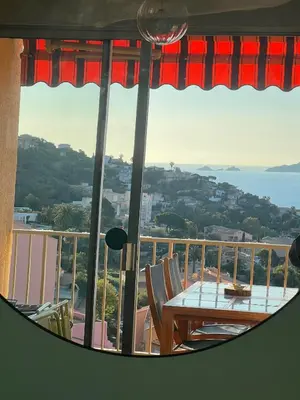 a view of a balcony with a table and chairs at Super appartement vue Sanguinaires in Ajaccio