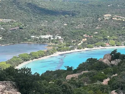 a view of a beach with blue water at T3 avec spa, hyper centre, port in Porto-Vecchio