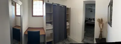 a bathroom with a blue cabinet and a sink at T3 avec spa, hyper centre, port in Porto-Vecchio