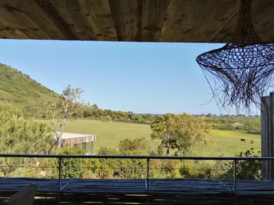 a view of a field from a basketball hoop at A1 Magnifique appt 6 personnes Lofts de Ste Lucie in Zonza