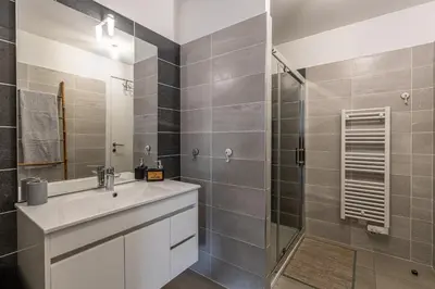 a bathroom with a sink and a shower at Nepita in Porticcio