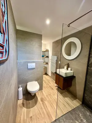 a bathroom with a toilet and a sink at Les Bergeries de Figari in Figari