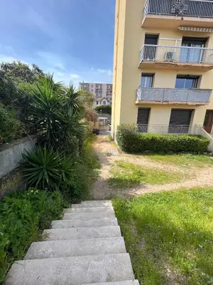 a path in front of a apartment building at Superbe T2 avec place de parking in Ajaccio
