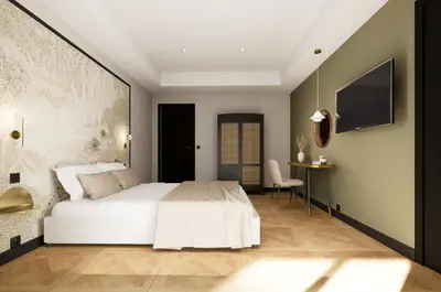 a bedroom with a white bed and a desk at Grand Hôtel de la Scala in Calacuccia