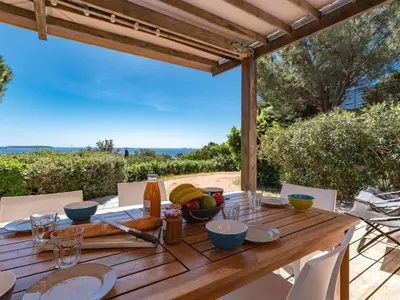 a bedroom with a bed with two towels on it at Holiday Home La Girelle by Interhome in Porto-Vecchio
