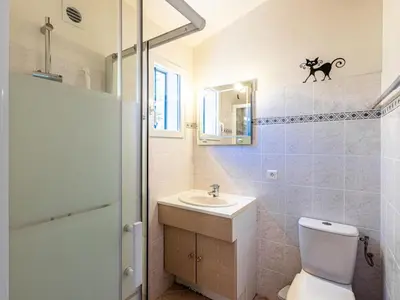 a kitchen and dining room with a table and chairs at Holiday Home La Girelle by Interhome in Porto-Vecchio