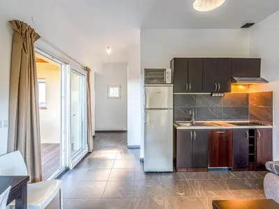 a bedroom with two beds and a window at Apartment Residence Marina di Favone- T2- 2-4 pers-3 by Interhome in Conca