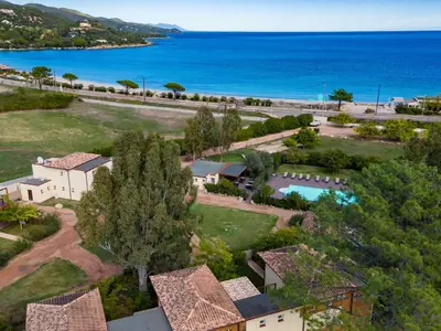 a park with two swings and a picnic table at Apartment Residence Marina di Favone- T3- 4-6 pers-4 by Interhome in Conca