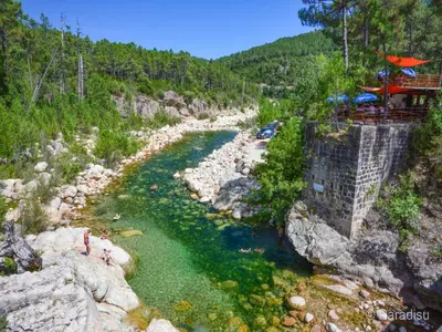 an aerial view of a river with green water at Les Jardins d'Eve, Solenzara, townhouse with private pool in Favone