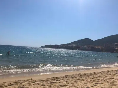 a large body of blue water with rocks and reefs at Très bel appartement avec terrasse de 87m2 avec une superbe vue panoramique sur la baie d Ajaccio in Ajaccio