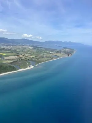 an island in the middle of a large body of water at Caravane janis on the beach in Lucciana