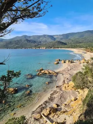 a view of a beach with rocks and the ocean at Mini Villa 69 - Piscine chauffée in Serra-di-Ferro