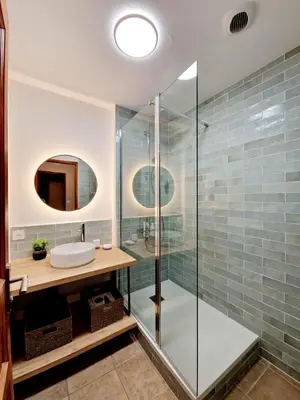 a bathroom with a glass shower and a sink at Mini Villa 69 - Piscine chauffée in Serra-di-Ferro