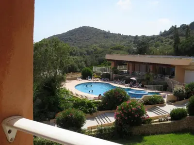 a view of a resort with a swimming pool at Bel app T2 en bord de Mer vue Sanquinaires piscine in Ajaccio