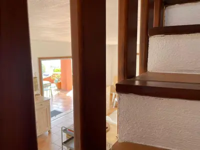 an open door to a living room and a kitchen at Maison de Lou in Porticcio