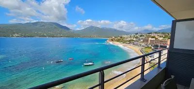a view of a beach with boats in the water at T2 de Standing Coté Plage, les pieds dans l'eau in Propriano