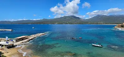 a view of a beach with boats in the water at T2 de Standing Coté Plage, les pieds dans l'eau in Propriano