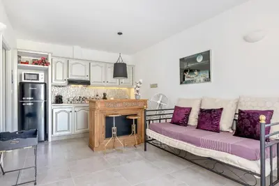 a living room with a couch and a fireplace at Villa des Orangers - Villa vue mer avec piscine in Grosseto-Prugna