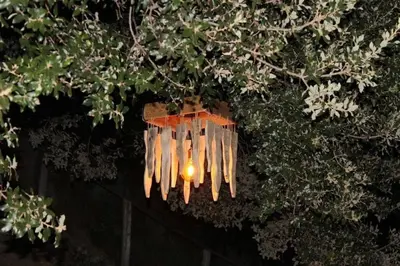a street light is hanging from a tree at Charmant T2 proche de Corte in Soveria