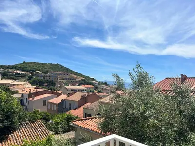 a view of a town with houses and trees at Idéal emplacement Cargese 3 in Cargèse