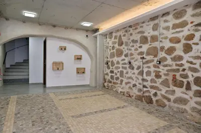 a room with a stone wall and a staircase at Résidence Mademoiselle Joséphine in Ajaccio