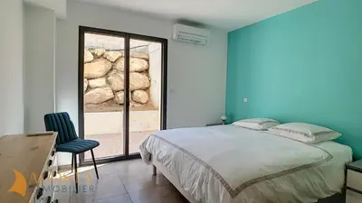 a bedroom with a bed and a window at T3 vue mer 100 m2 de jardin 'D' in Pietrosella