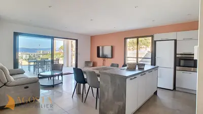 a kitchen with an open floor plan with a living room at T3 vue mer 100 m2 de jardin 'D' in Pietrosella