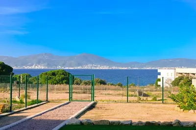 a soccer field with the ocean in the background at T3 vue mer 100 m2 de jardin 'D' in Pietrosella
