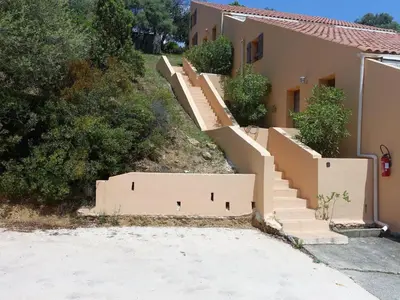 a set of stairs leading up to a house at Apartment Residence Cabanaccia 3 Pieces 4 Pers by Interhome in Serriera