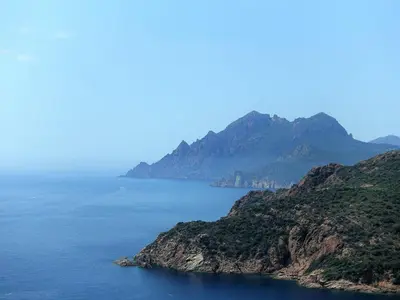 a view of a large body of water with mountains at Apartment Residence Cabanaccia 3 Pieces 6 Pers-3 by Interhome in Serriera