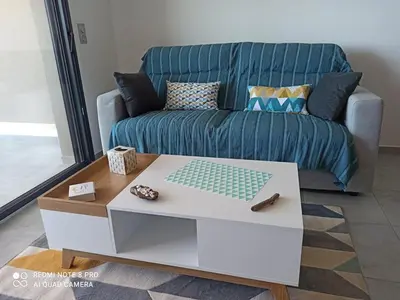 a living room with a couch and a coffee table at La Civita Piétrosella in Pietrosella