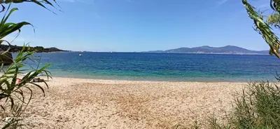 a beach with a large body of water at La Civita Piétrosella in Pietrosella