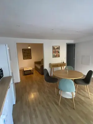 a living room with a table and chairs and a couch at Calenzana GR20 in Calenzana