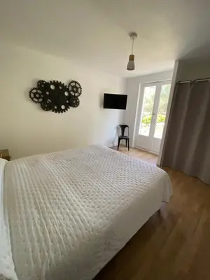 a bedroom with a white bed and a window at Calenzana GR20 in Calenzana