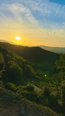 a view of the sunset from the top of a hill at A CASA DI GHJULIA PISCINE CHAUFFEE PROCHE St FLORENT in Vallecalle