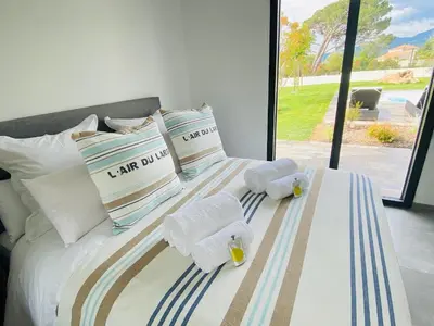 a bedroom with a bed with towels on it at Capella Suttana in Ventiseri