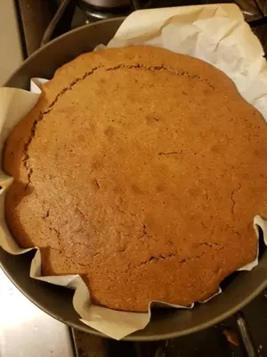 a cake sitting in a pan on a stove at Chambre d'Hôte 