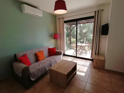 a living room with a couch and a coffee table at MAISON ALBA ROSSA 55 in Serra-di-Ferro