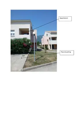 a view of a building from the street at Charmant appartement dans résidence avec piscines in Santa-Maria-Poggio