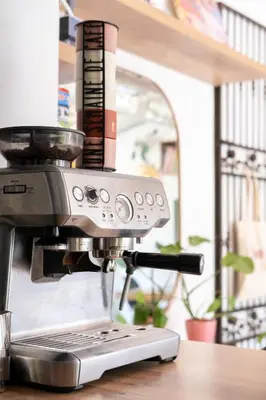 a kitchenaid espresso machine sitting on a table at CASA MONICA CARGESE - Roseroom - Chambre d hote in Cargèse