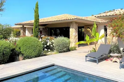 a villa with a swimming pool and a house at Villa Pignotulli Di Cirendinu in Sainte-Lucie de Porto-Vecchio