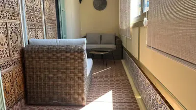 a hallway with chairs and a couch in a room at LA CASA GIL in Ajaccio