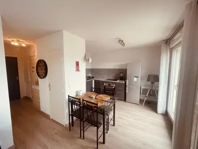 a kitchen and dining room with a table and chairs at Grand studio toit terrase Ajaccio in Ajaccio