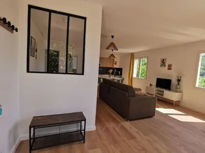a living room with a couch and a table at Appartement 2 ou 4 personnes. Venaco in Venaco