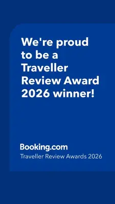 a blue sign that says were proud to be a traveller reviewagency winner at Villa avec terrasse et vue piscine, proche plage in Moriani Plage
