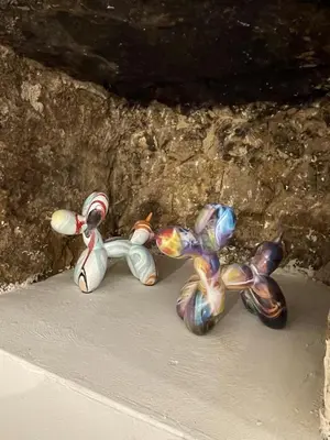 three stuffed animals are sitting in a cave at The Charming House in Ville-di-Paraso